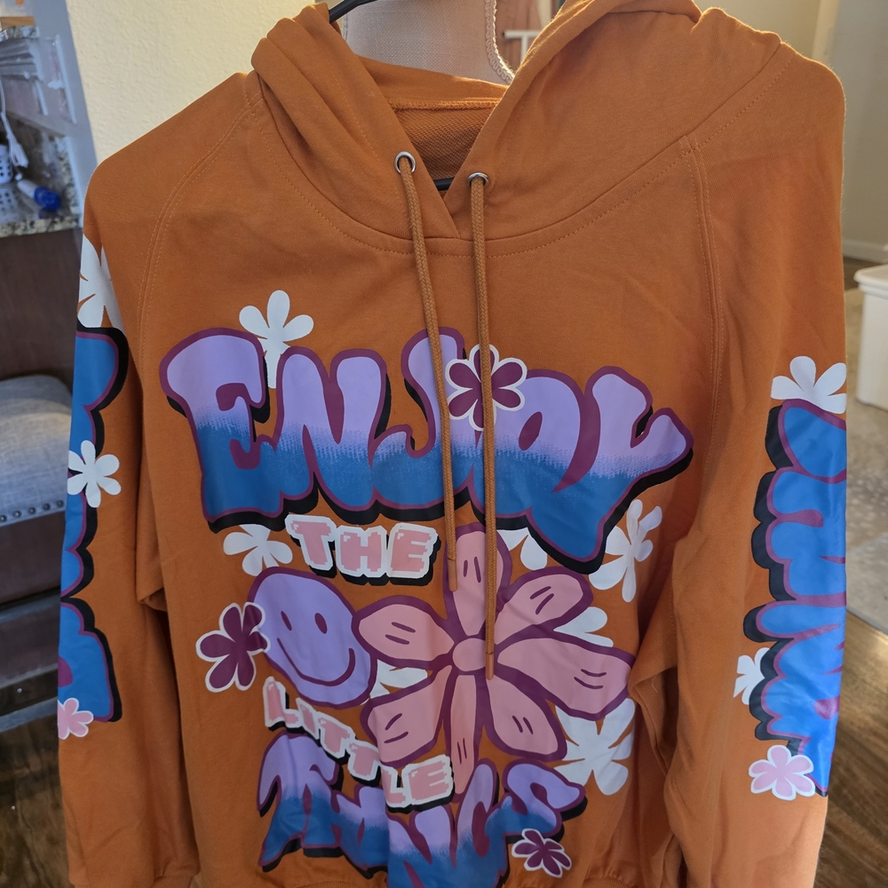 Orange Graphic Hoodie with Floral Design. Fantastic FAWN
